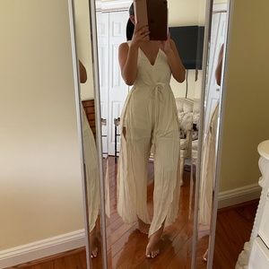 Tan Honey Belle jumpsuit with side cut outs and slits.